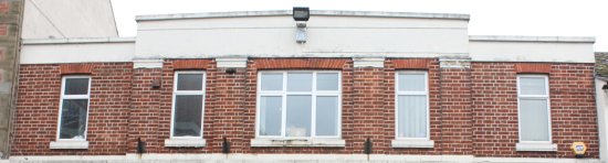 The standard upper frontage of the Woolworths stores